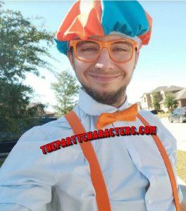 Blippi impersonator smiling in costume