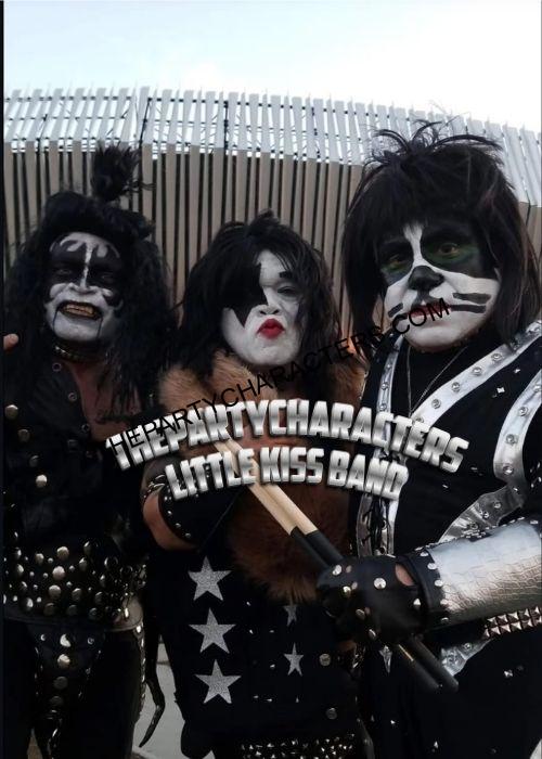 Little people rock band with guitars and makeup