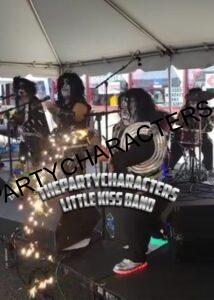 Little Kiss band performing live on stage in full makeup